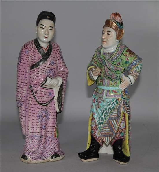 A Chinese porcelain figure of a man and a figure of a man in pink robes